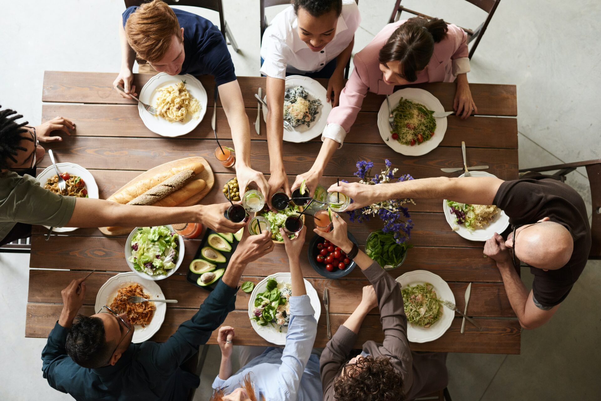 people cheering during the lunch - Hygge hotel friends
